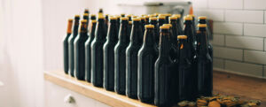 Bottles of brown beers on counter