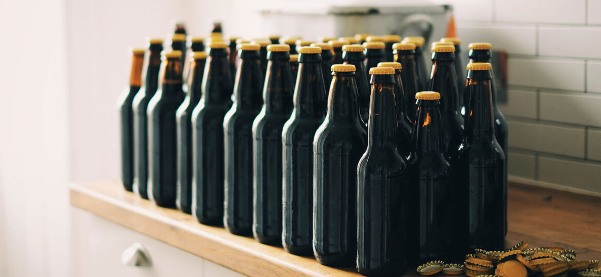 Bottles of brown beers on counter
