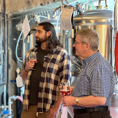 to guys listening while getting brewery tour