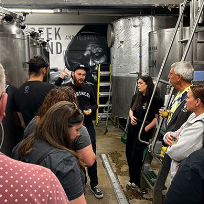 beer trippers getting a tour of brewery
