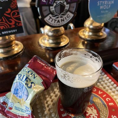 Pint of Dark beer with chips