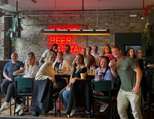 happy beer trippers enjoying pints at the doghouse in Edinburgh