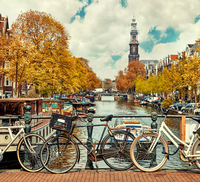 bicycles chained to bridge in Amsterdam