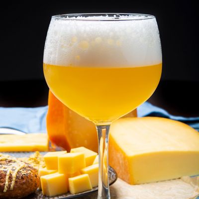 beer in proper glassware next to cheese in classic Holland cafe