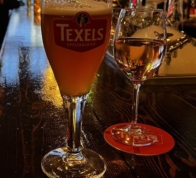 Texels beer next to a glass of wine in a pub in the Netherlands