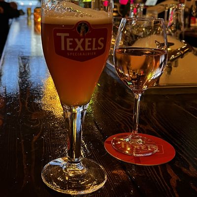 Texels beer next to a glass of wine in a pub in the Netherlands