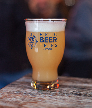 pint glass of beer with epic beer trips logo