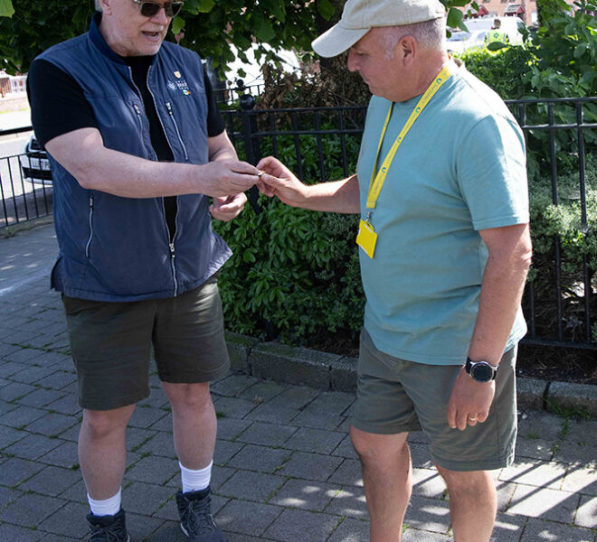 Captain Kurt presenting pin to Beer tripper