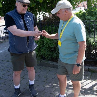 Captain Kurt presenting pin to Beer tripper