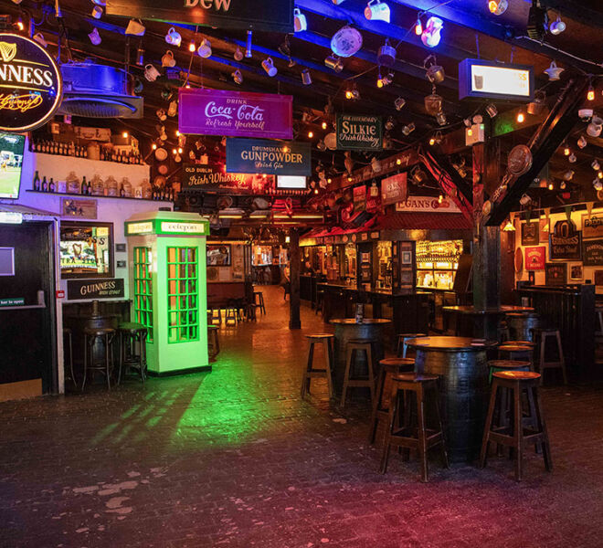 colorful pub interior with beer lights and signage