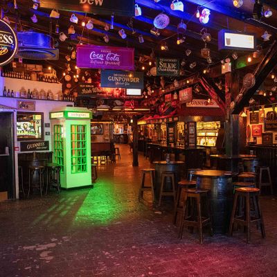 colorful pub interior with beer lights and signage
