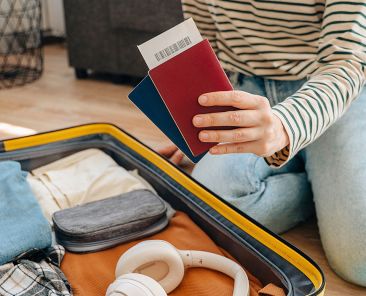 woman with passport packing for UK beer trip