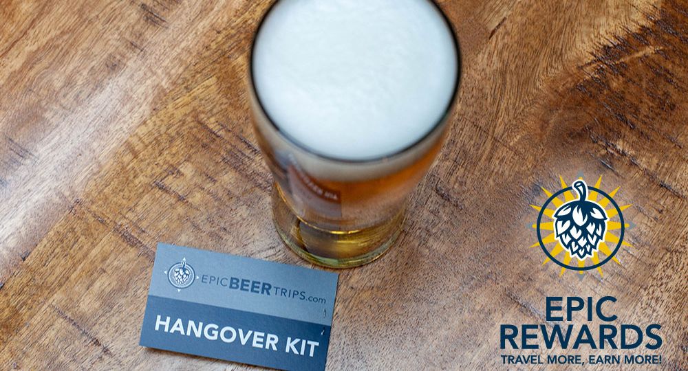 beer pint on wooden table with epic beer trips hangover kit and Epic Rewards logo
